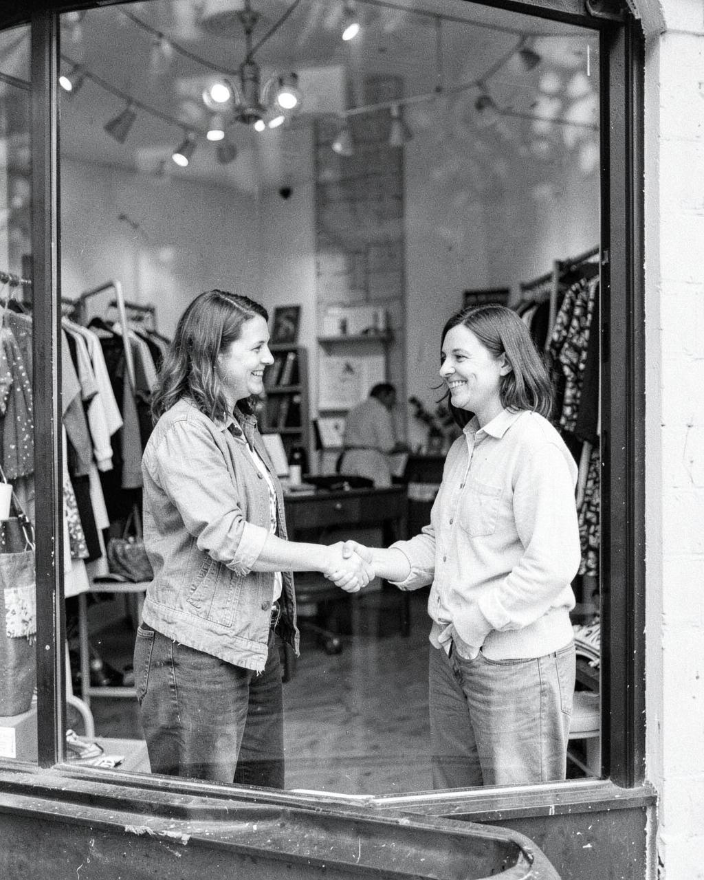 Two local business owners shaking hands